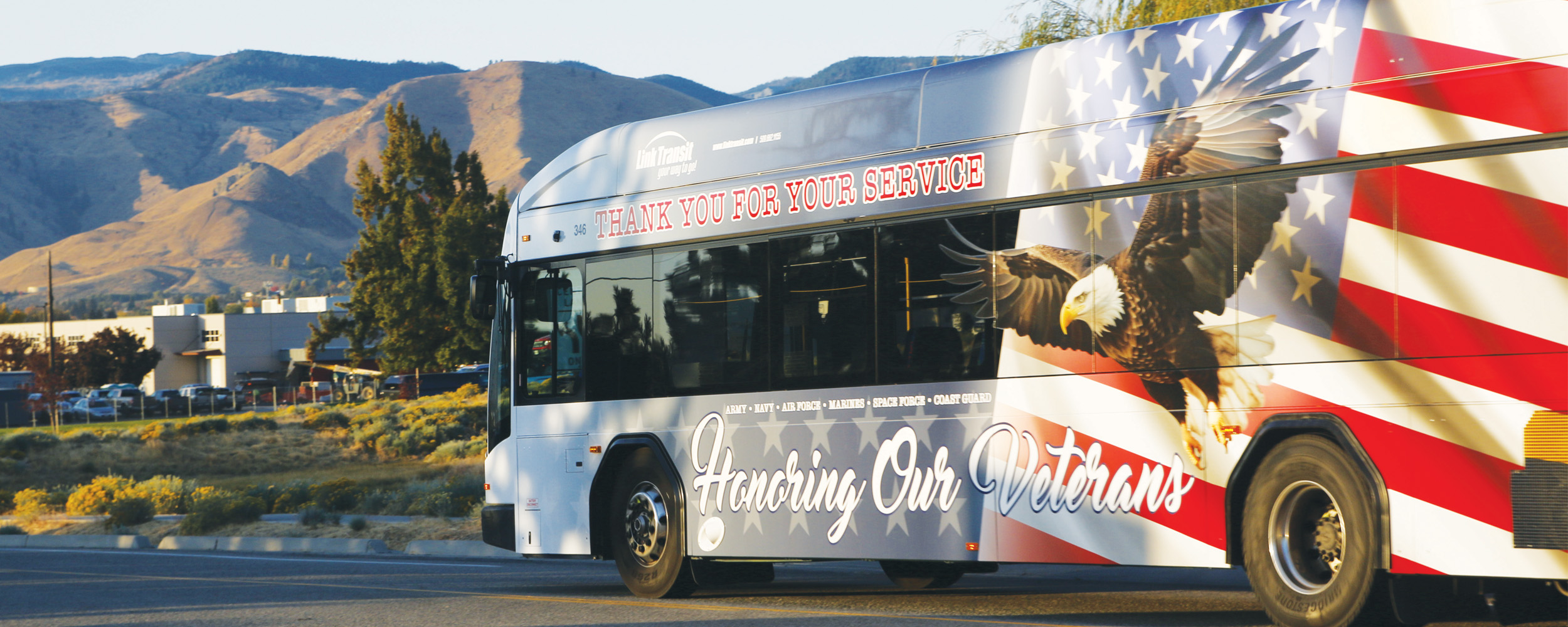 Thank you for your service honoring our Veterans bus wrap with US flag and bald eagle